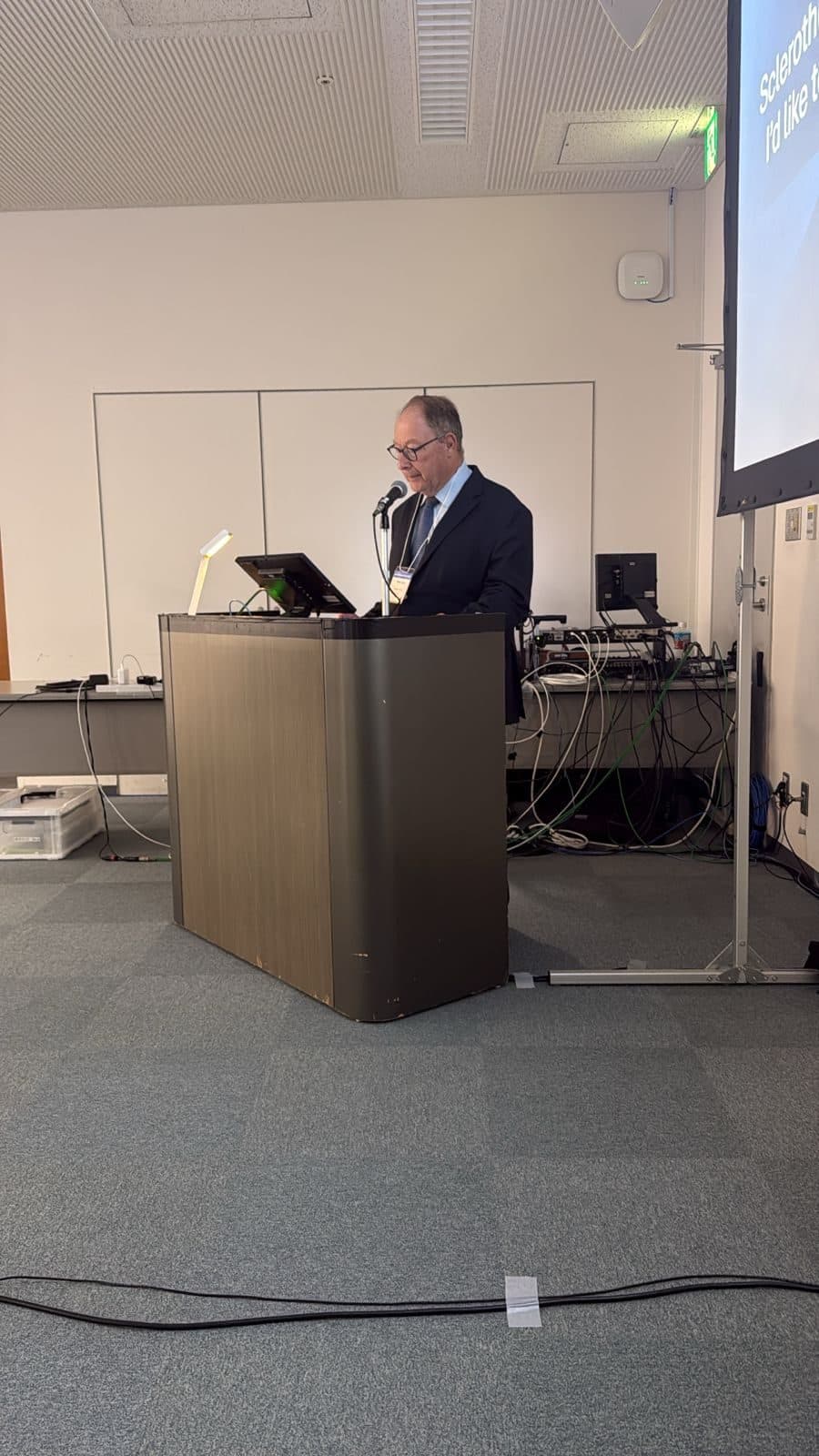 A faculty member lecturing at the podium during the Asian Venous Forum 2026